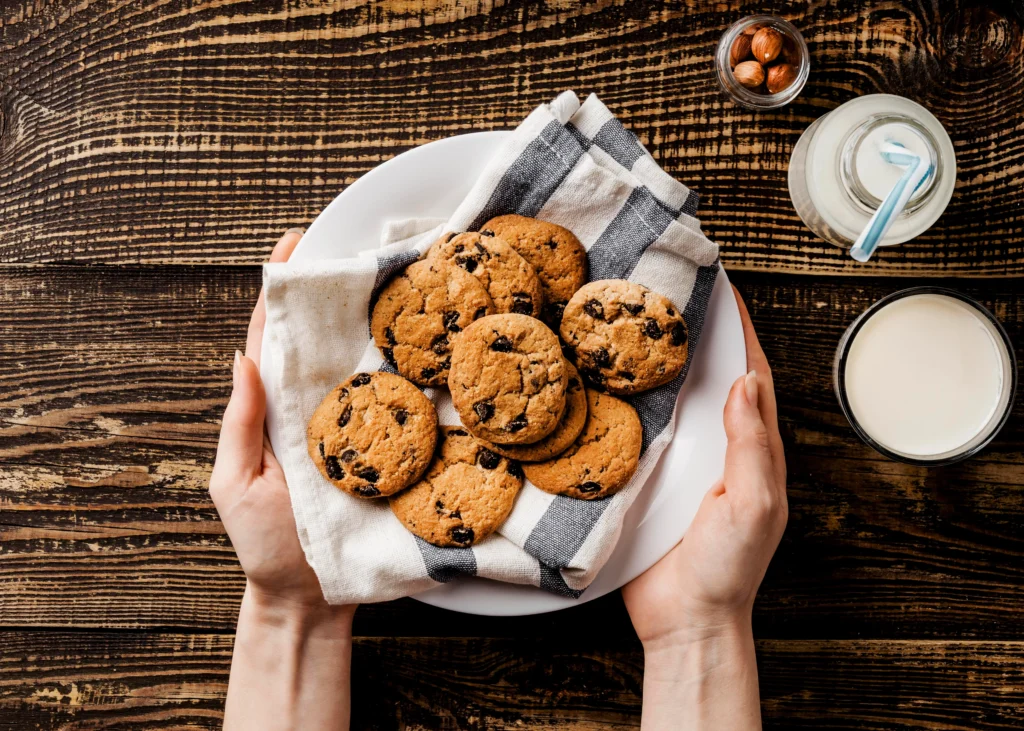 Close-up of golden-edged chocolate chip cookies without brown sugar on a cooling rack.