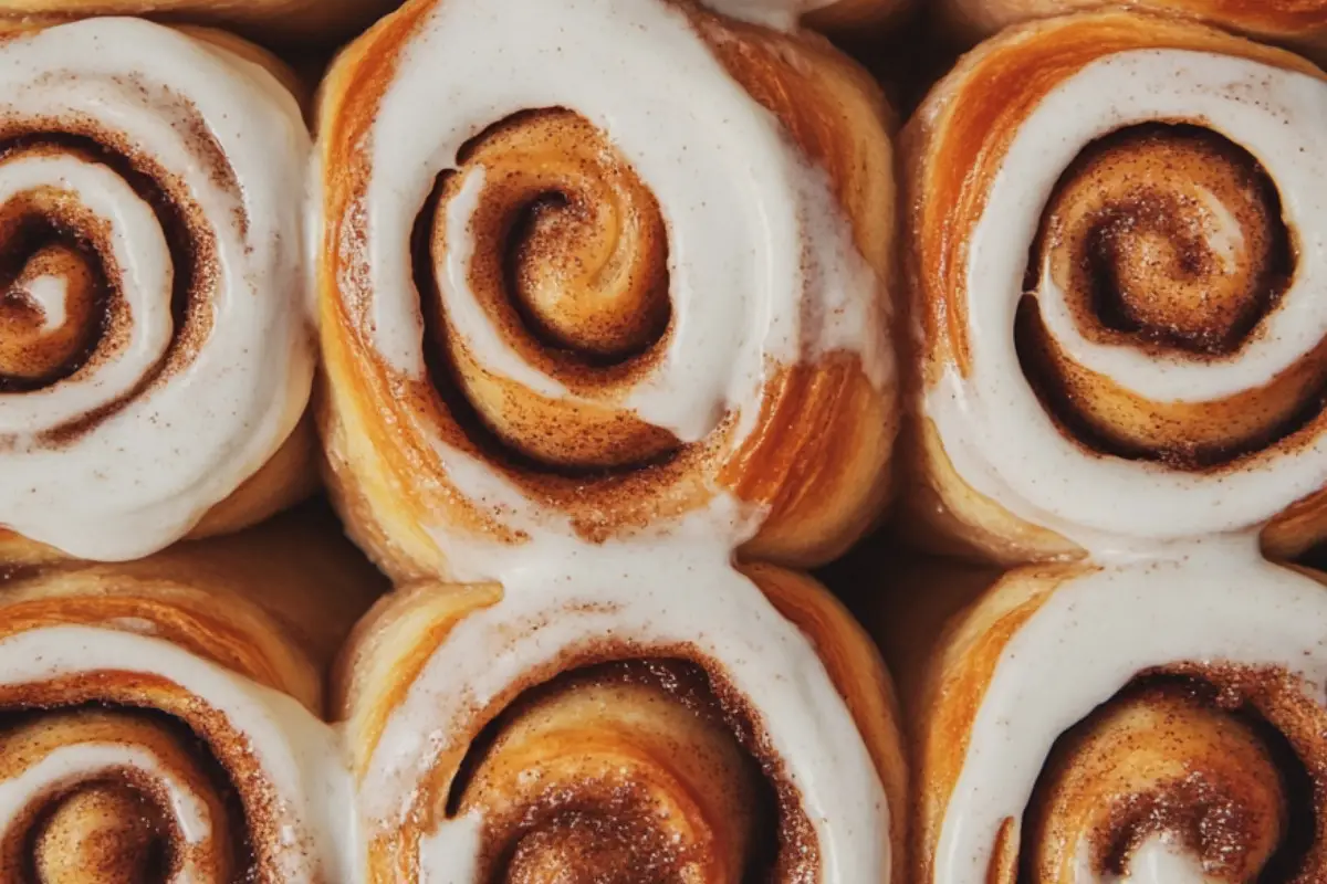 Spiced Peach Cobbler Cinnamon Rolls with Creamy Frosting