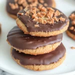 chocolate dipped Butterfinger cookies cooling on rack
