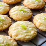 Glazed Coconut Lime Cookies on wooden plate