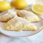 Glazed lemon scones on a rustic plate
