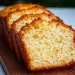 Eggless coconut loaf cake fresh from oven